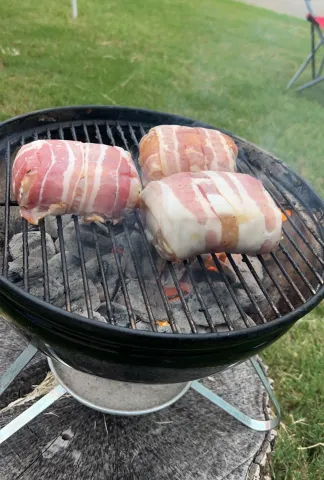bacon wrapper chicken breasts on a grill